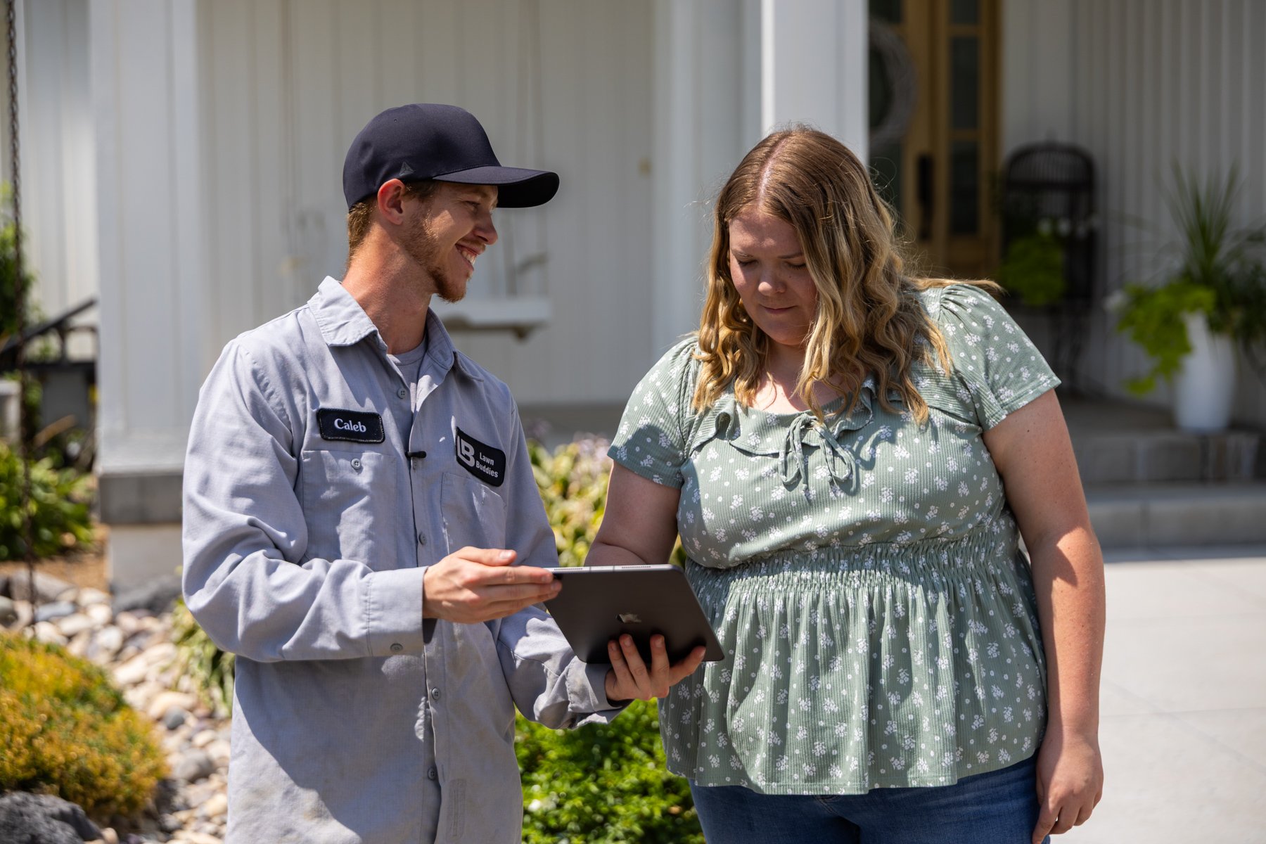 Lawn Buddies technician and customer