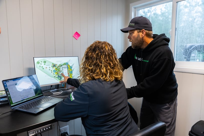 Village Gardener team members computer