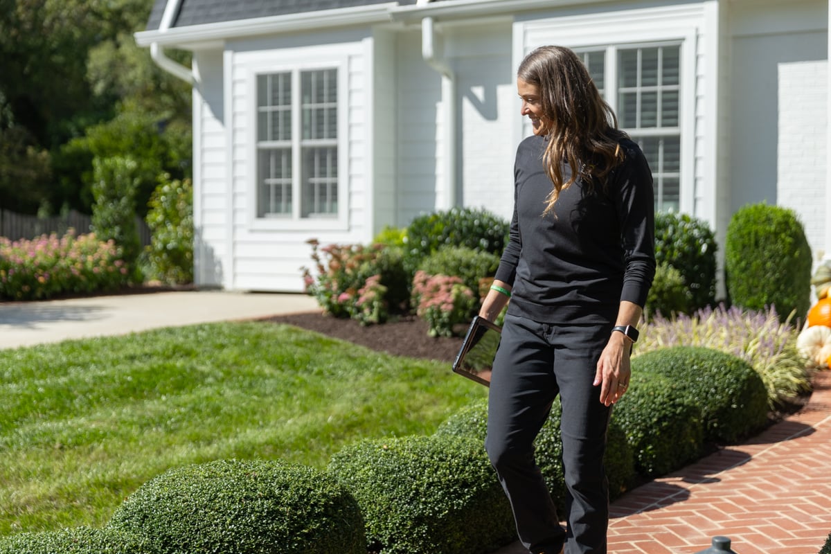 account manager designer inspecting - kingstowne lawn and landscape