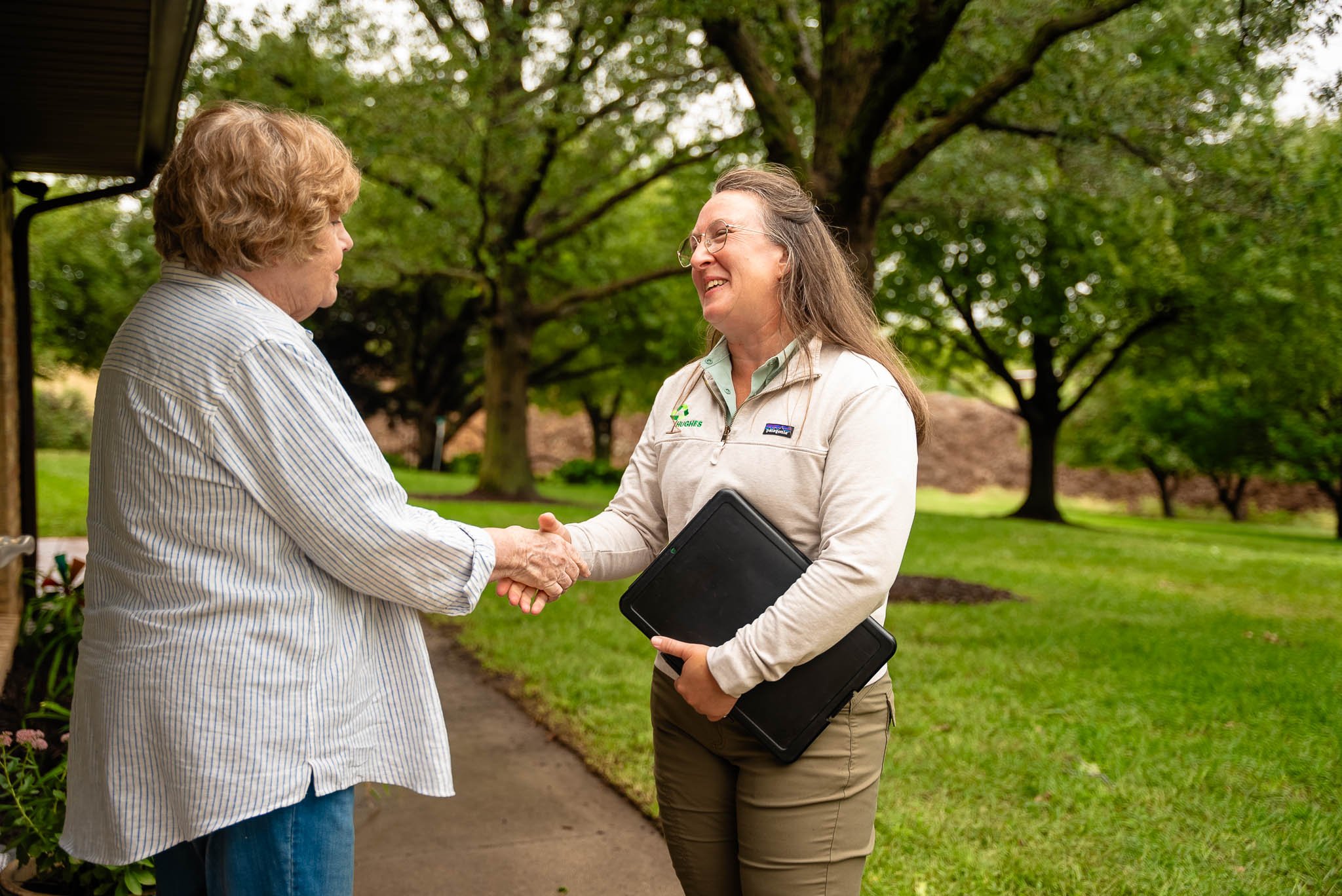 arborist with customer - Hughes